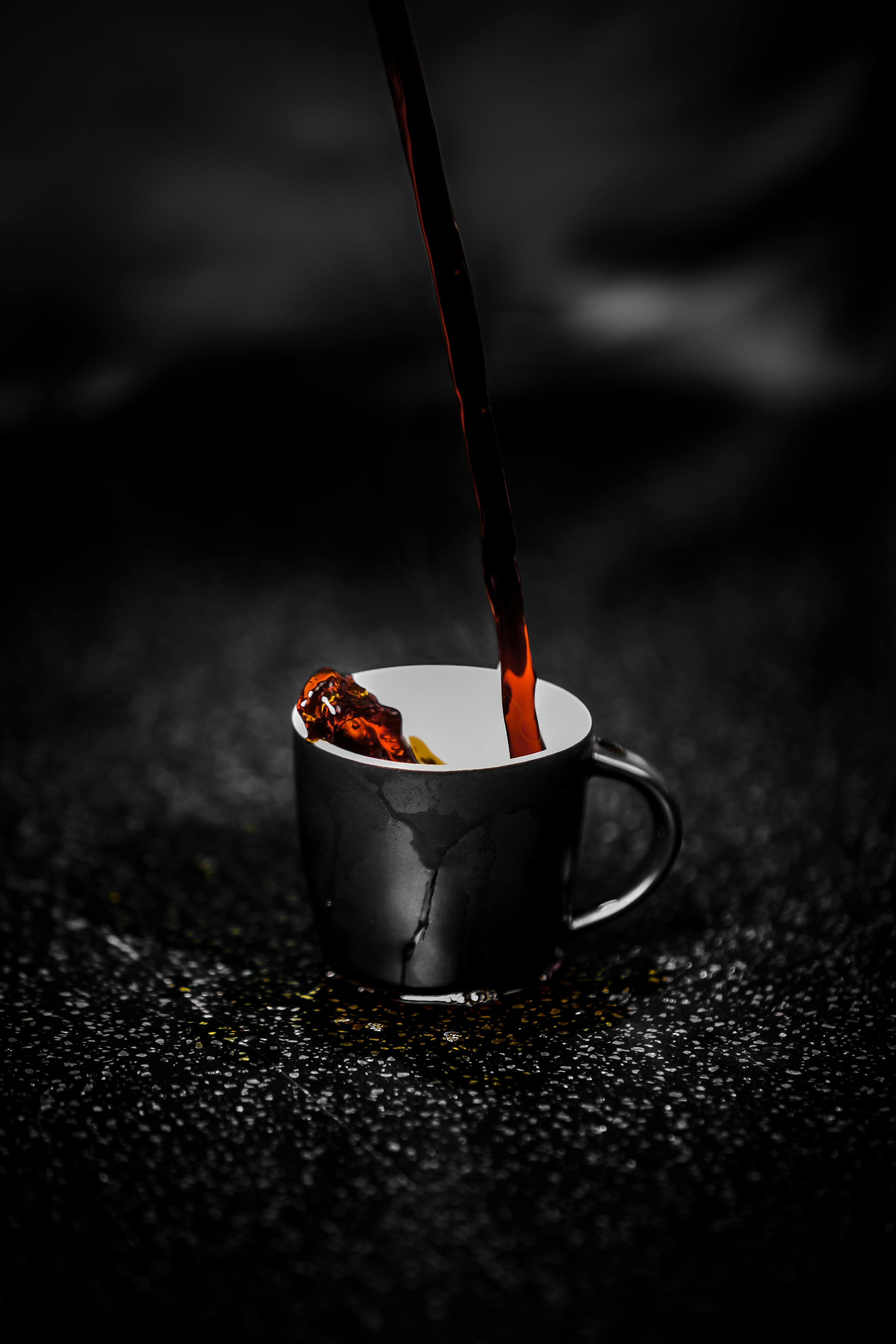 Hot coffee pouring into a ceramic cup - bold fresh brew from The Millennial Brew, captured mid-pour for a rich morning vibe